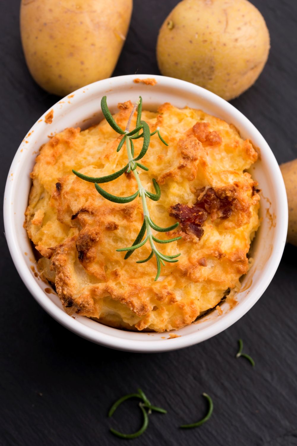 Whipped cream cheese potato souffle in a white ramekin