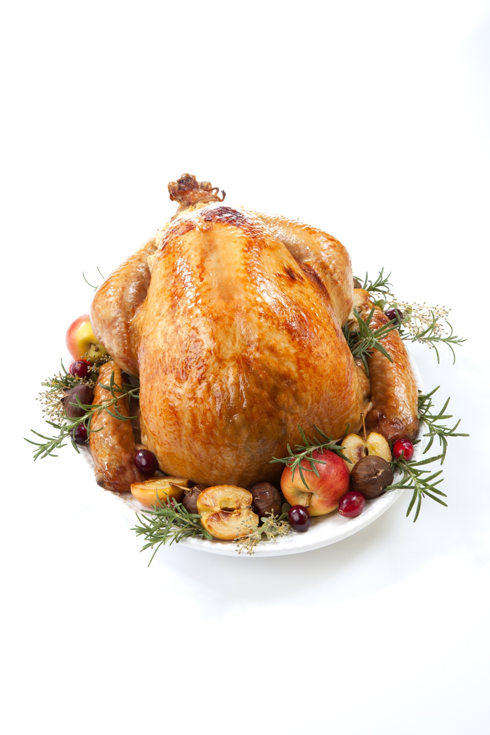 Garnished roasted turkey on a white platter