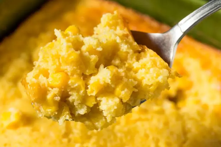 Close-up of homemade corn pudding casserole on a fork