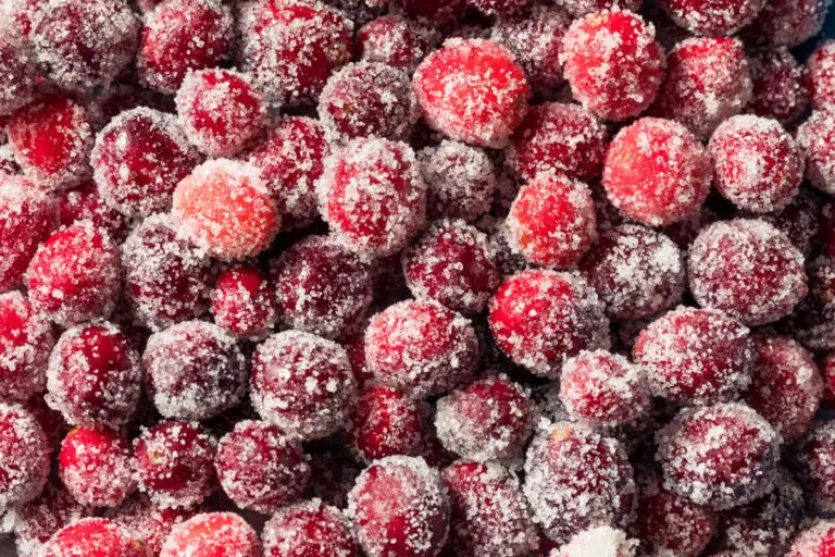 Vintage candied cranberries recipe from 1930 showing jewel-like berries coated in crystallized sugar