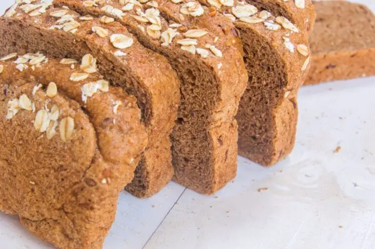 Close-up of sliced Prairie Bread topped with oats.