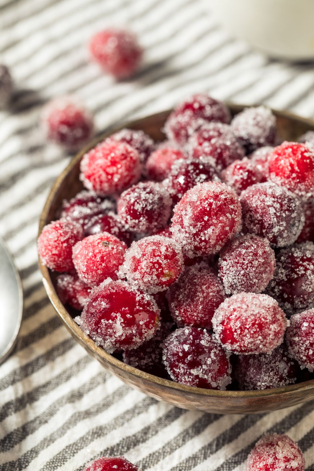 Vintage candied cranberries recipe from 1930 showing jewel-like berries coated in crystallized sugar