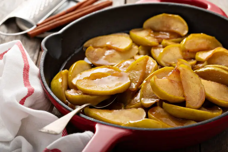 Fried apples with cinnamon in a cast iron skillet, fall side dish