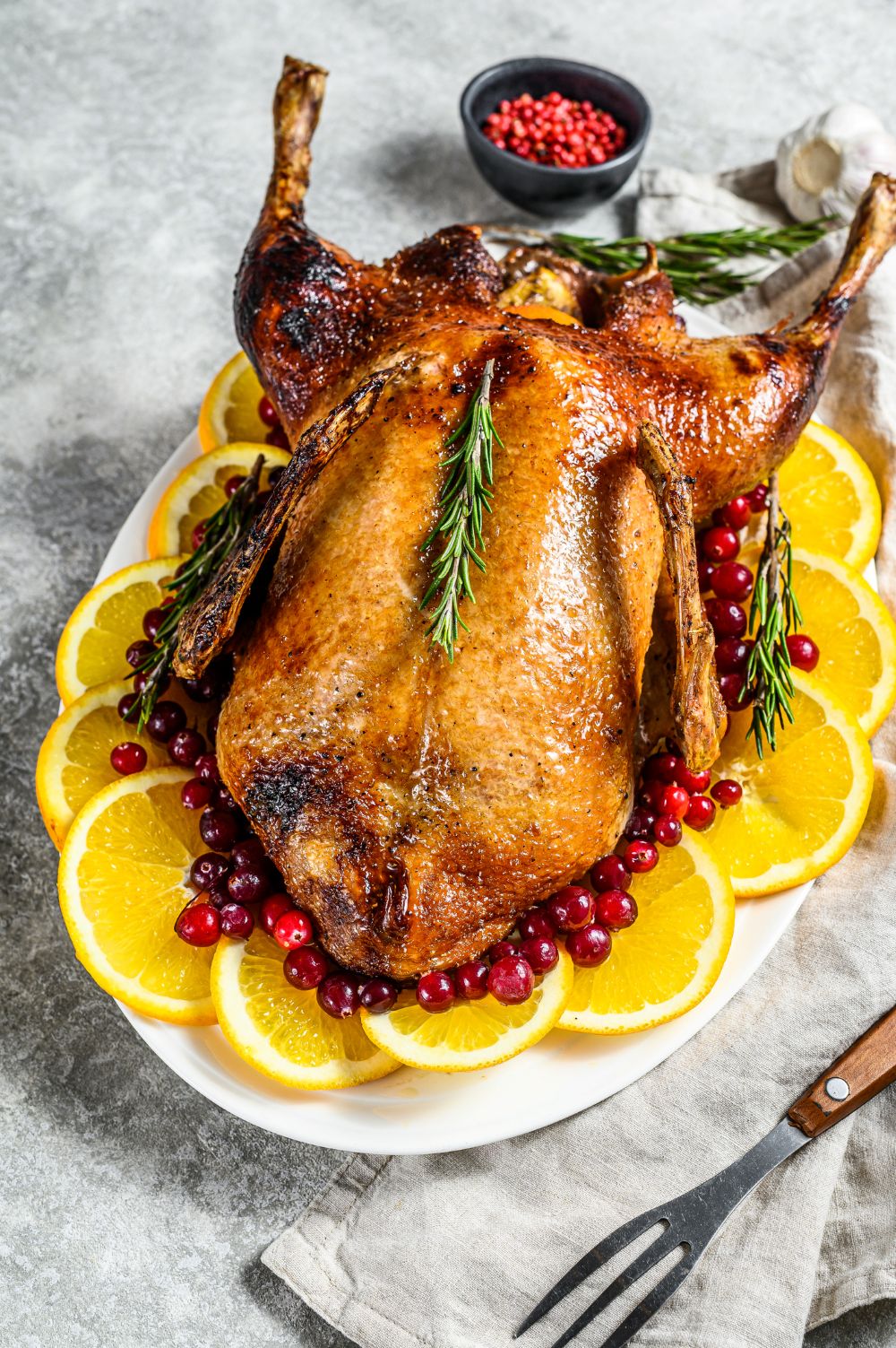 Roasted duckling garnished with orange slices