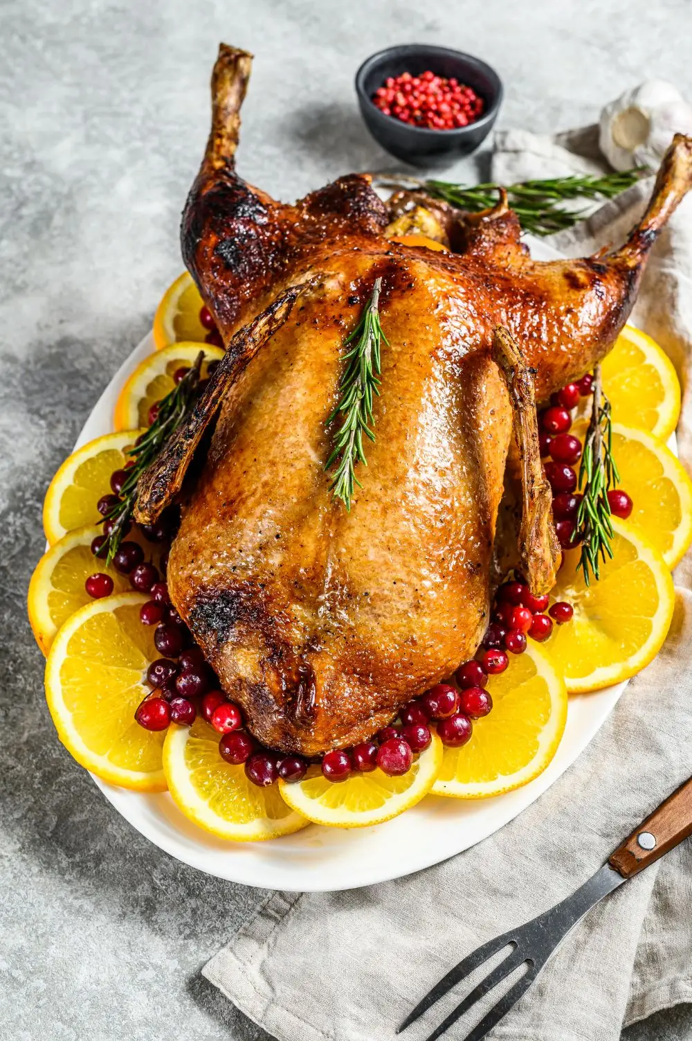 Roasted duckling garnished with orange slices