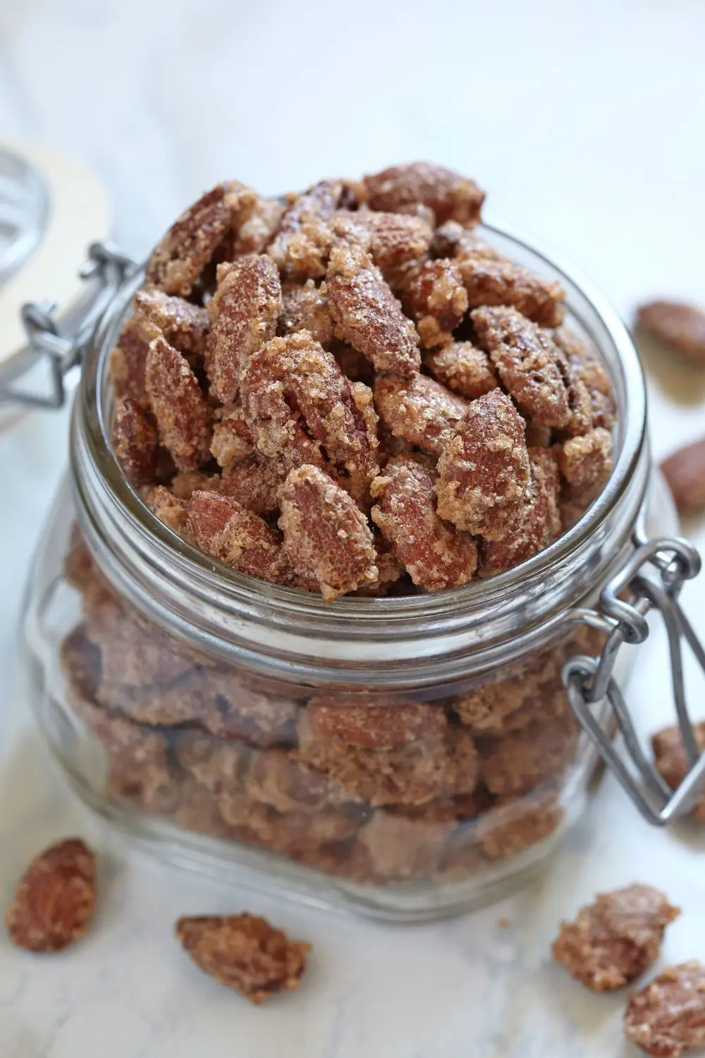 Old fashioned candied almonds in a glass jar