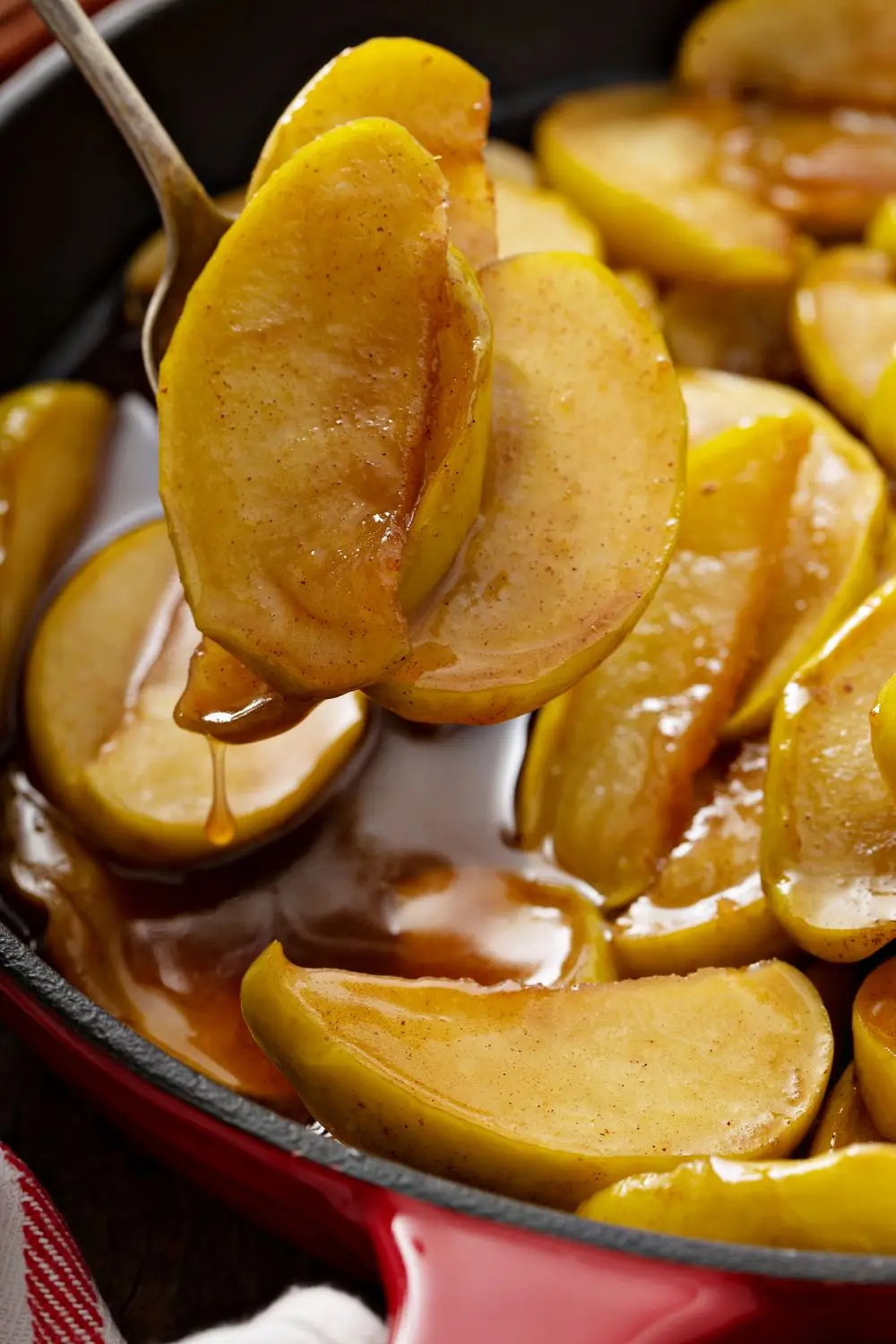 Stewed apples with cinnamon in a cast iron skillet, fall side dish
