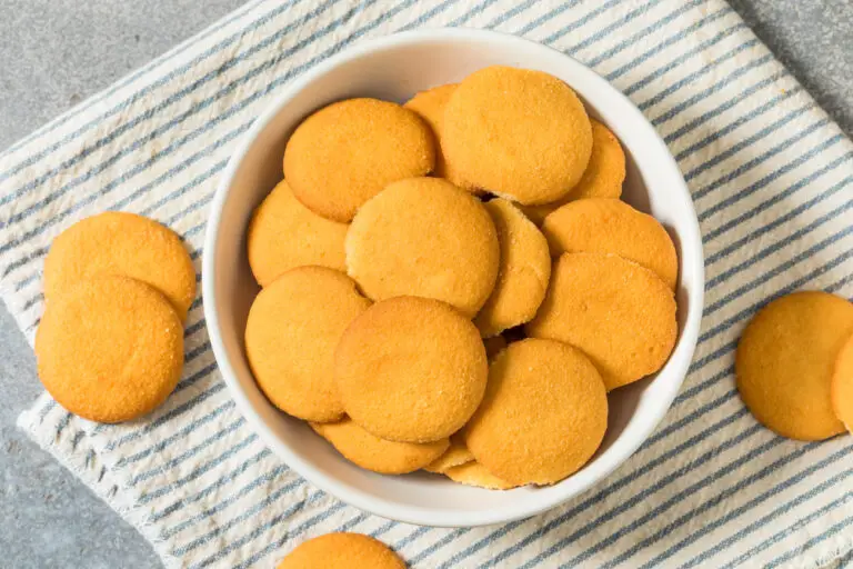 Homemade vanilla wafers in a white bowl.