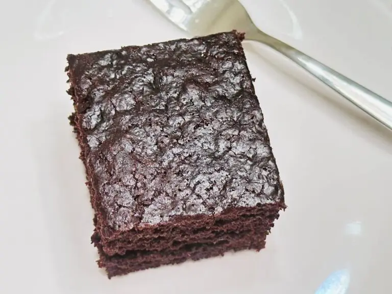 Square of Wacky Cake on a white plate.