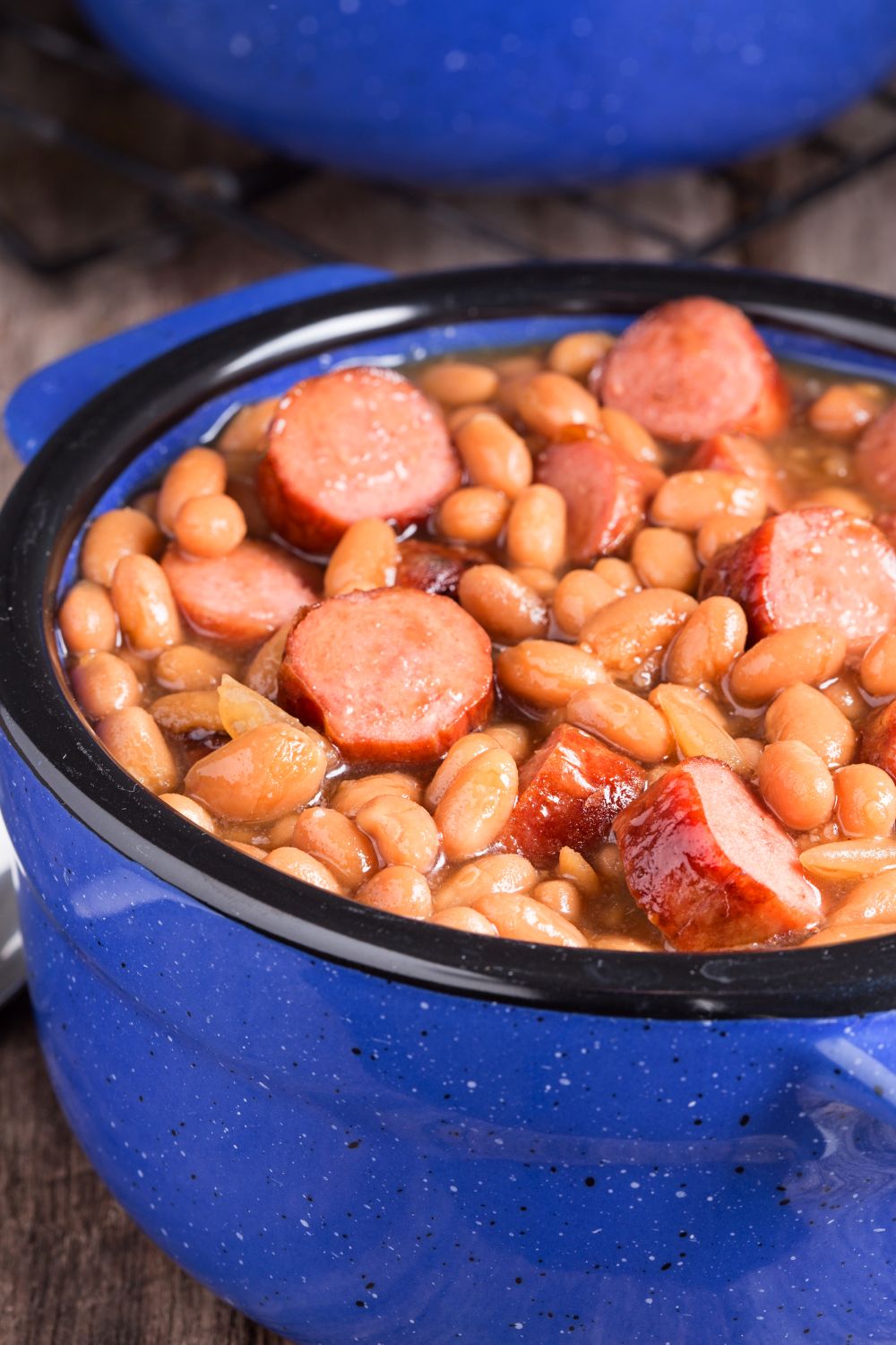 classic franks and beans casserole in blue ceramic bowl