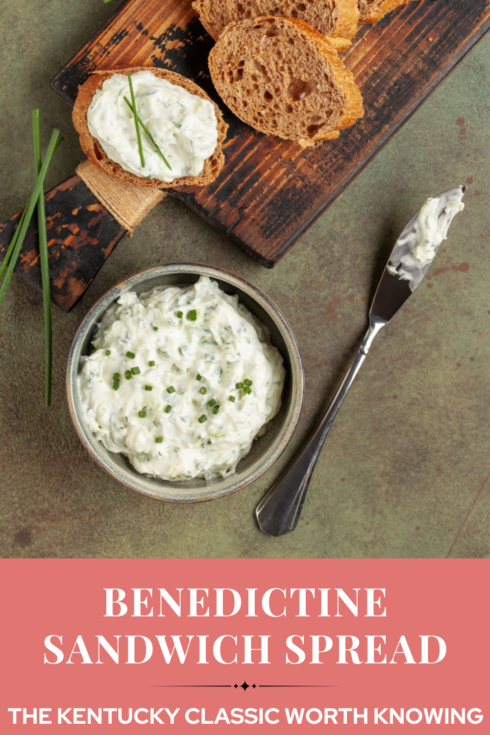 Benedictine sandwich spread on sliced pumpernickel garnished with chives