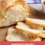 sliced homemade braided challah bread topped with sesame seeds