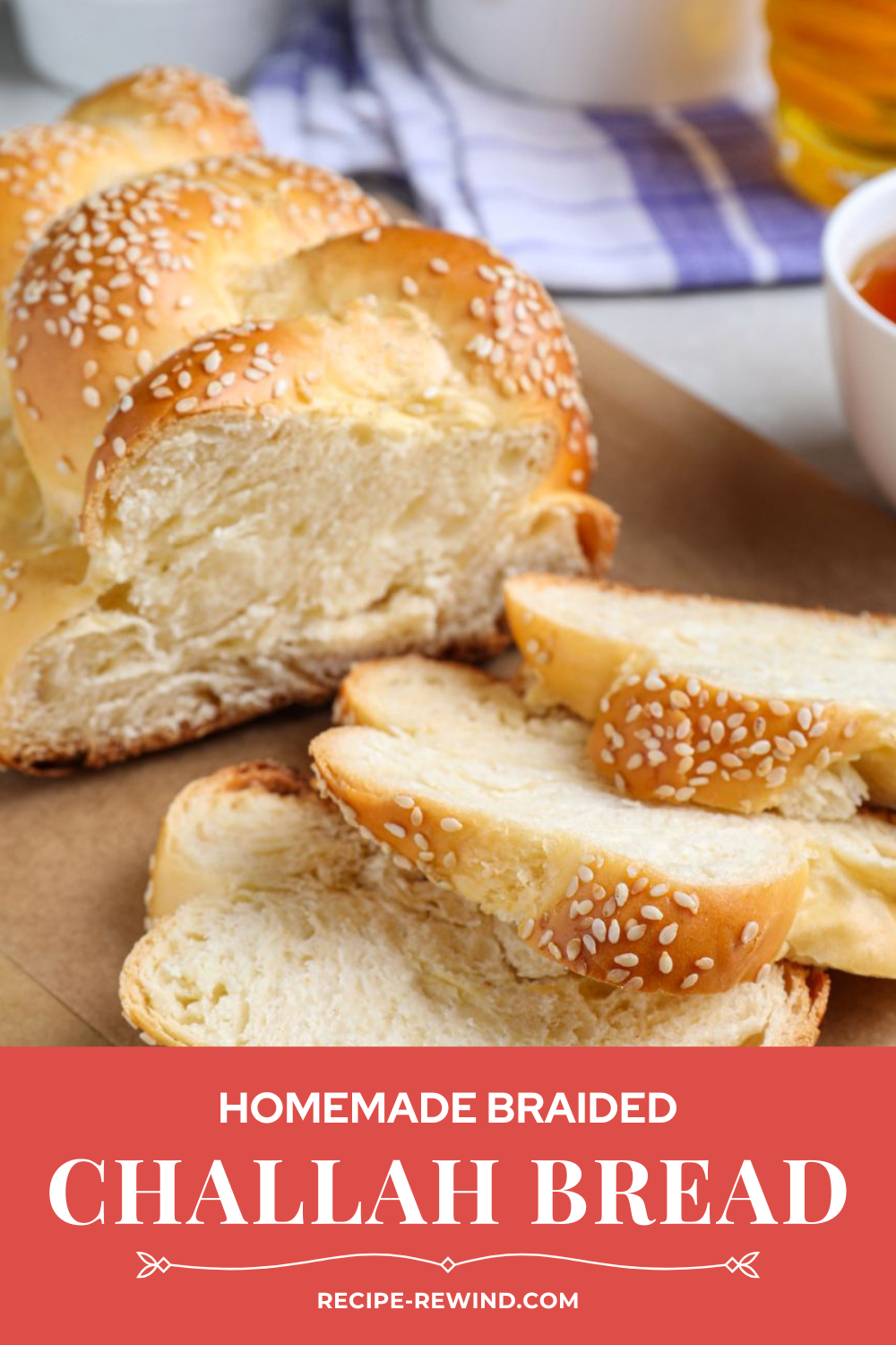 sliced homemade braided challah bread topped with sesame seeds