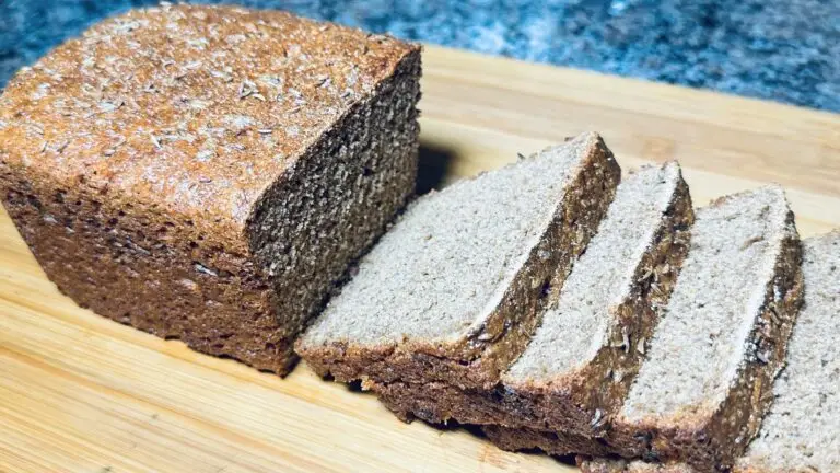 easy einkorn bread recipe pictured here sliced on a wooden cutting board