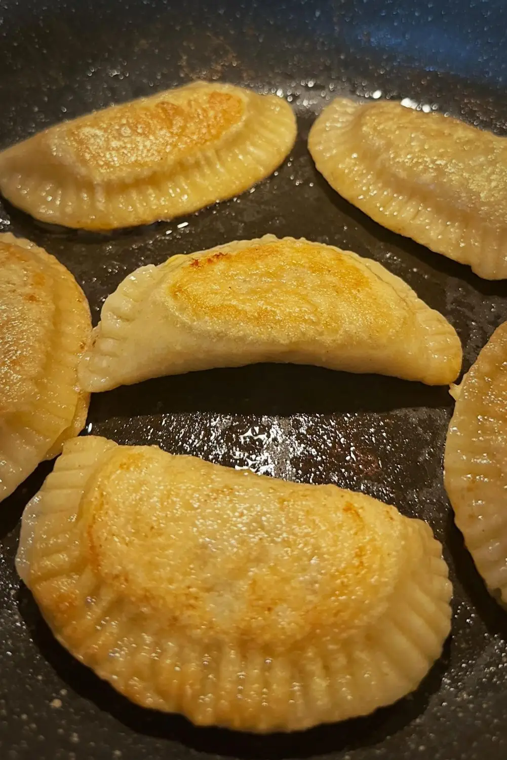 golden brown pierogies after frying in butter