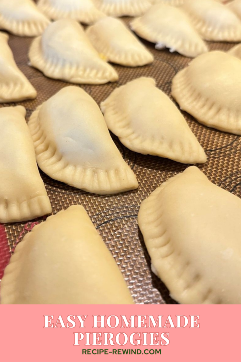 tray of uncooked, crimped pierogies ready to boil